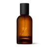 Amber glass Aesop Silently Hwyl Eau de Parfum bottle with black cap on a white background.